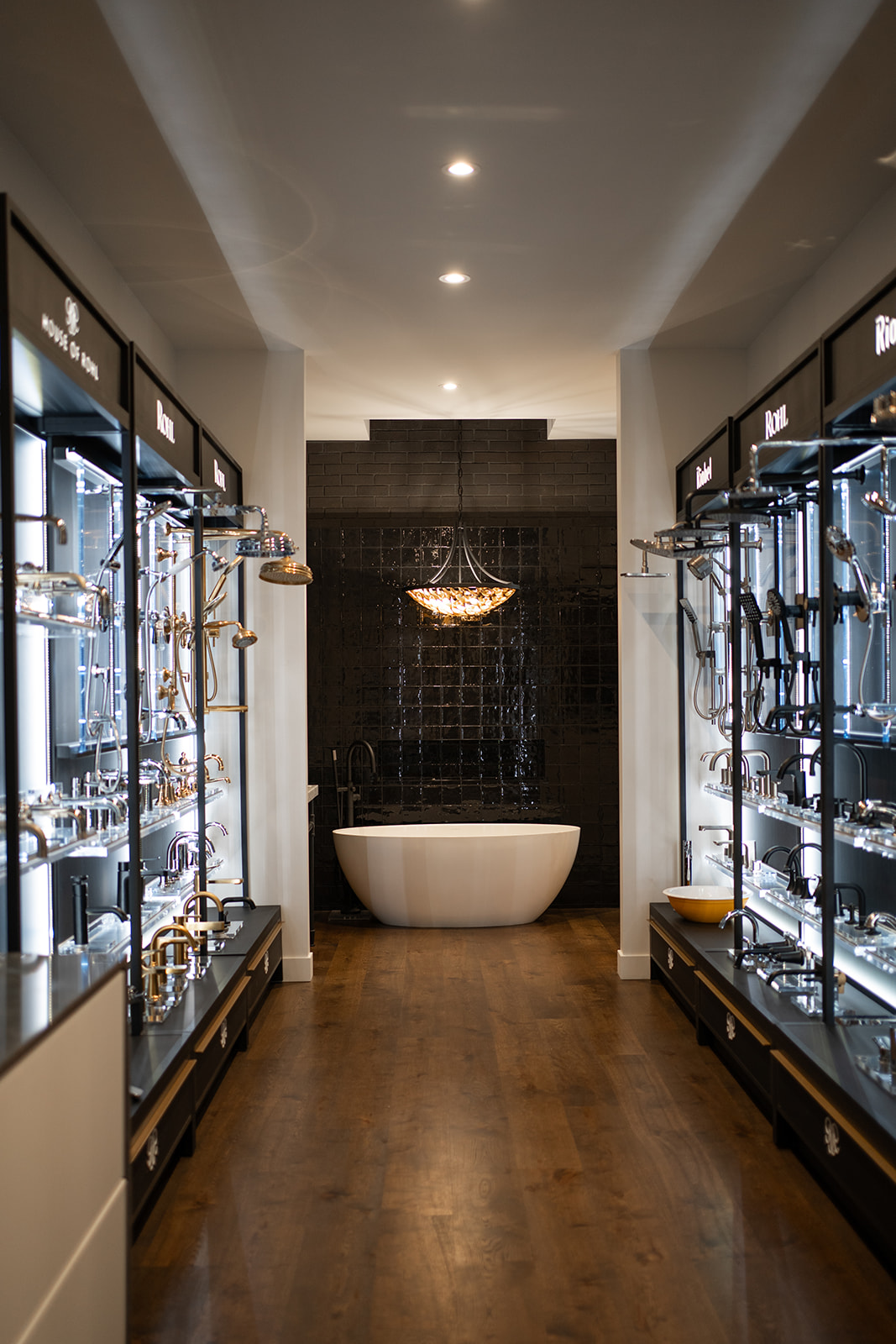 Modern bathroom vanity with matte black faucet and round mirror