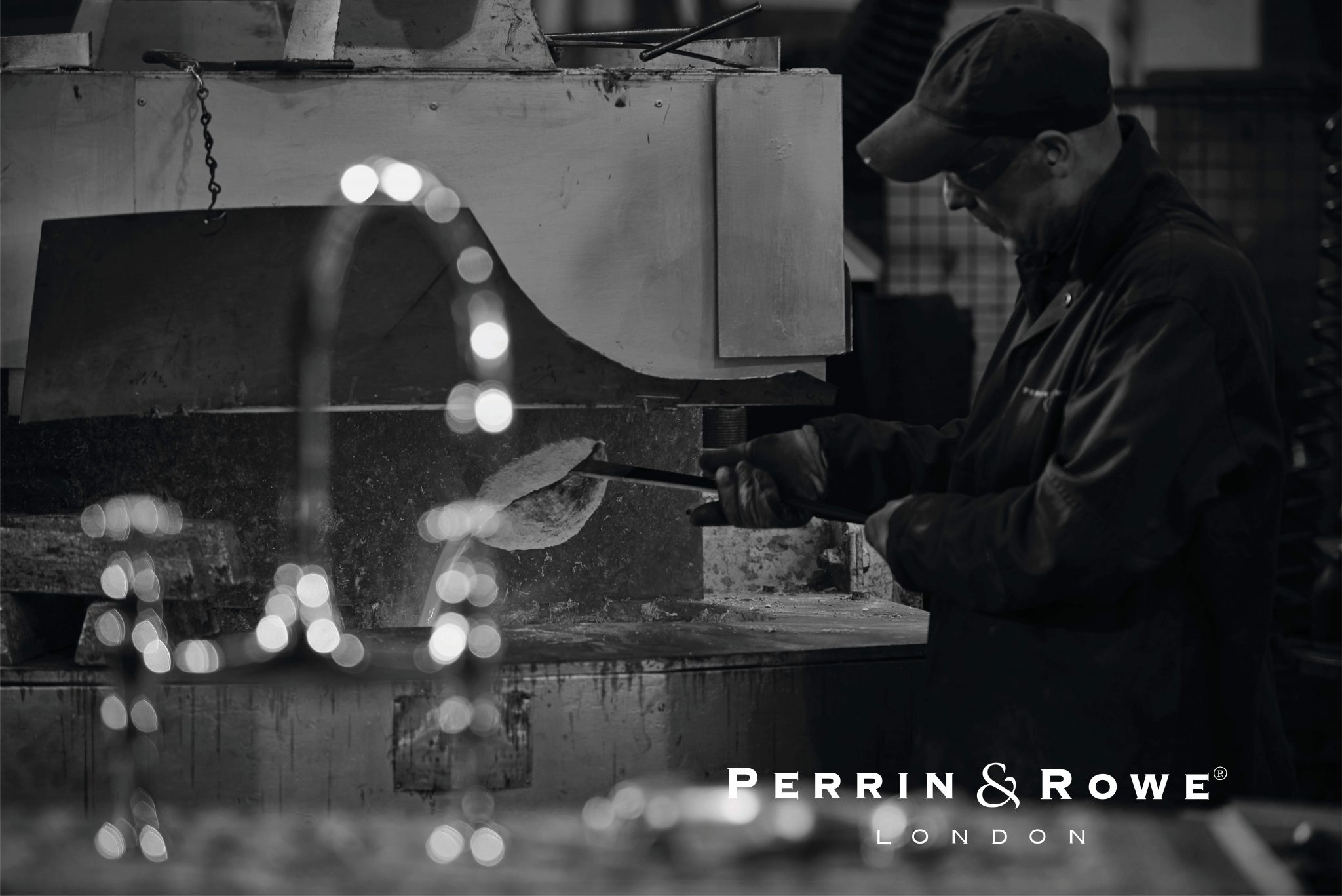 Artisan handcrafting a brass faucet in a workshop